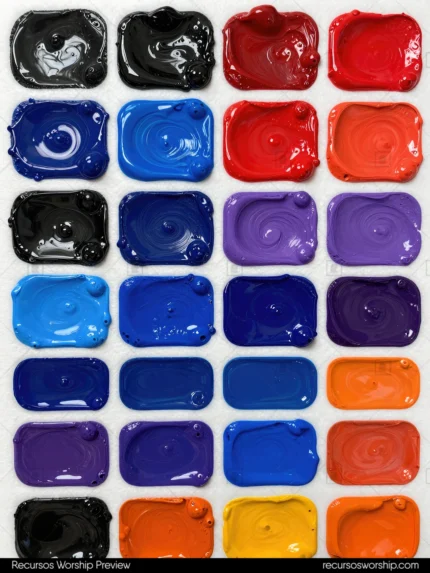 Mosaico paletas pintura artistica pigmento denso negro azul real profundo rojo carmin morado lila naranja compartimentos rectangulares huellas espatula oleo espeso vertical cenital artista textura